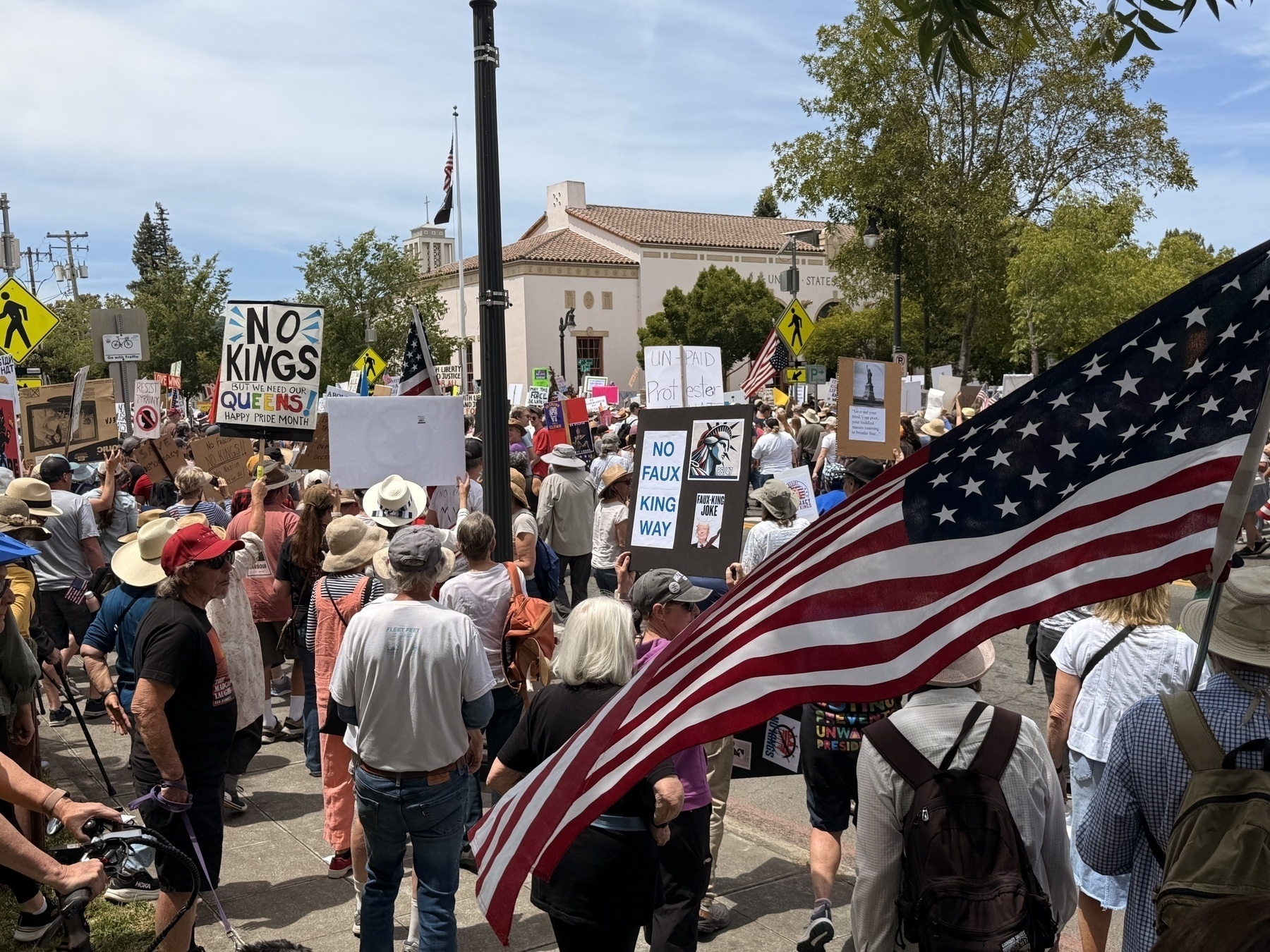 Hundreds of protesters march past the US post office in Petaluma California